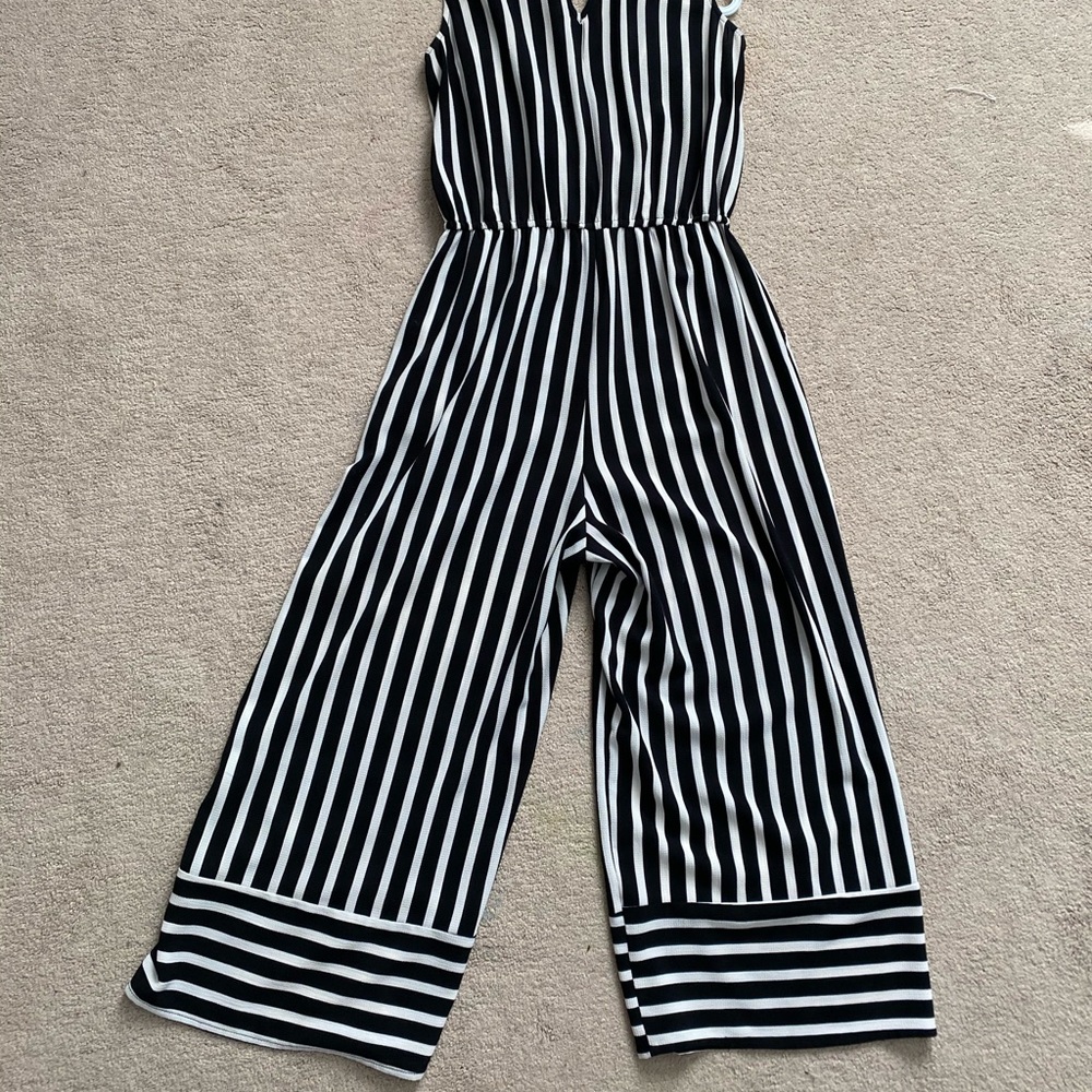 Size medium jumpsuit. Barely worn, light material